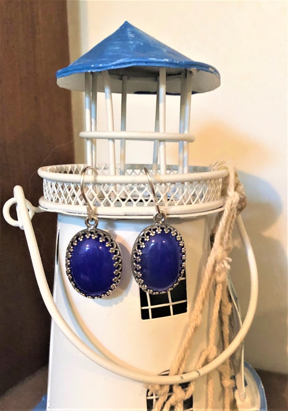 Blue Onyx earrings are set in a silver-plated crown bezel and have sterling silver ear wires