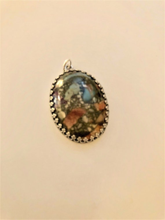 Sea Sediment Jasper Cabochon encased in a Silver Plated Setting.