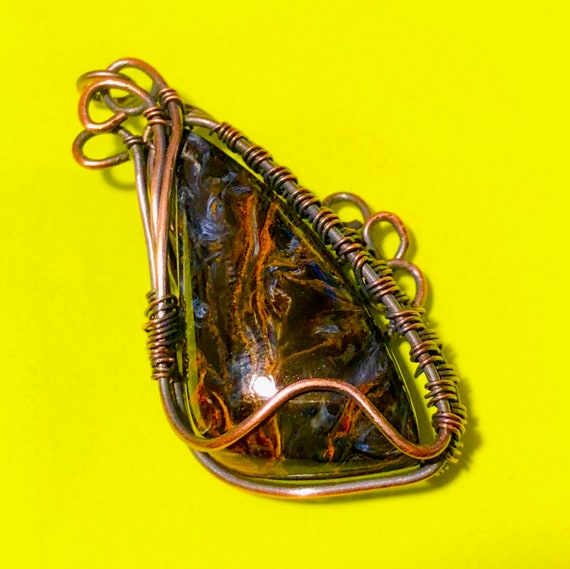 Unique Namibian Pietersite gemstone pendant wire wrapped in antiqued copper wire.