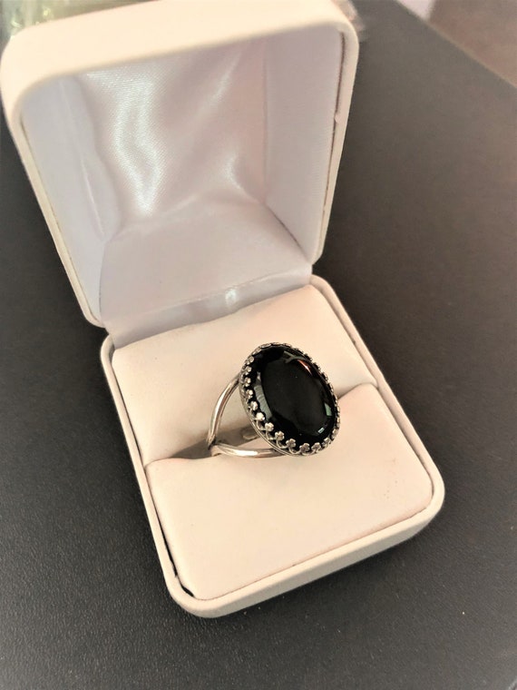 Black Onyx adjustable ring in a Silver-plated Crown setting.