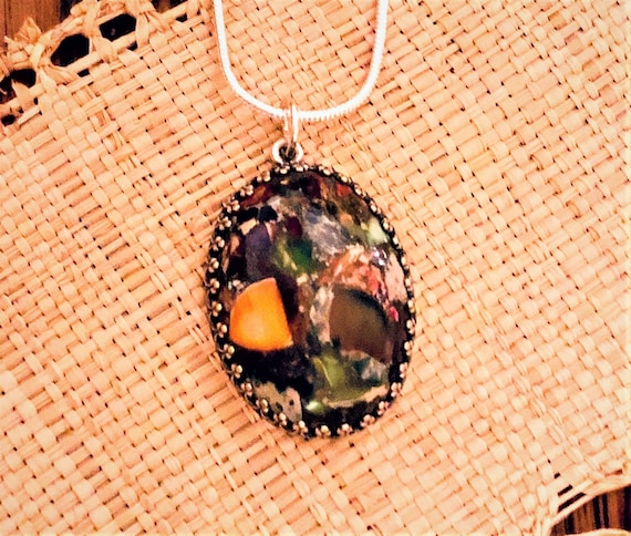 Sea Sediment Jasper Cabochon encased in a Silver Plated Setting.