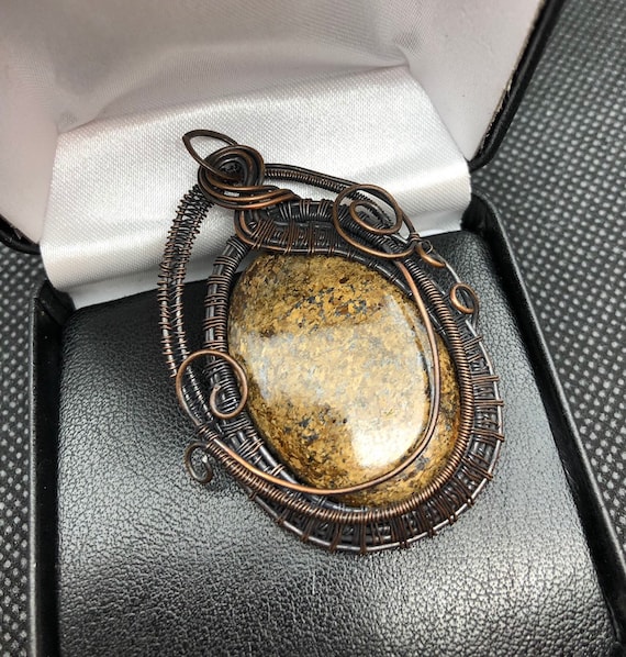 Bronzite Cabochon Pendant w/ Oxidized Copper Wire.   Bronzite properties are Clarity, Protection, Youth