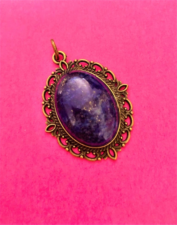 Lapis Lazuli Cabochon Pendant encased in a Brass Setting.