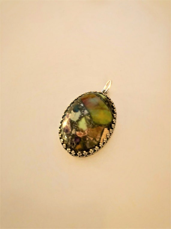 Sea Sediment Jasper Cabochon encased in a Silver Plated Setting.