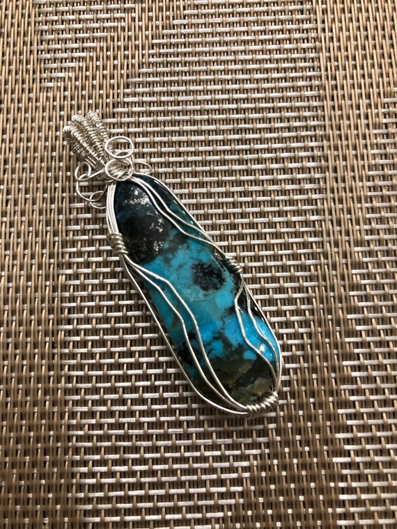 Arizona Turquoise Pendant wrapped in Sterling Silver Wire.