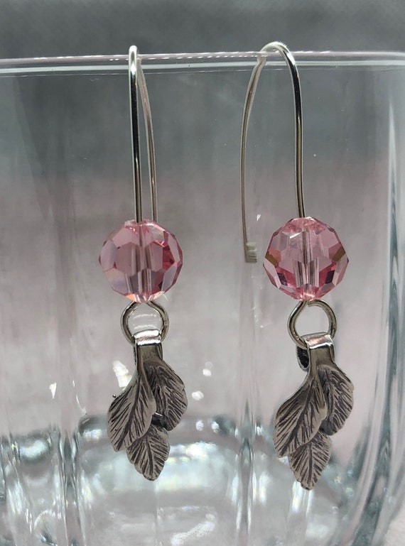 Sterling Silver Leaf Earrings adorned with Swarovski Crystals.