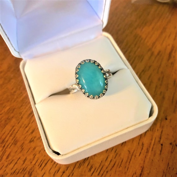 Amazonite adjustable ring encased in a silver-plated crown bezel.