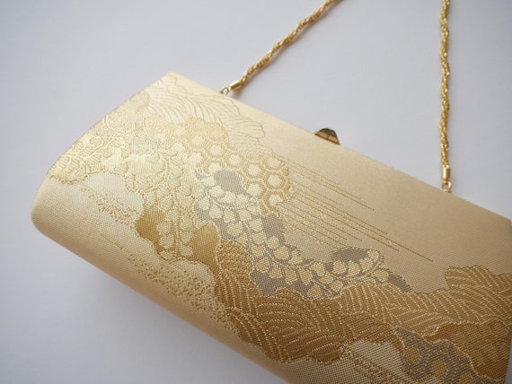 shiny gold clutch bag