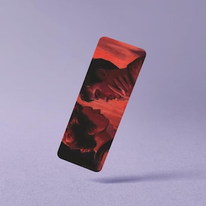 May include: A rectangular bookmark featuring a digital illustration of two figures facing each other in profile. The artwork uses a vibrant red and orange color palette, depicting the figures with dark hair against a warm, glowing background.