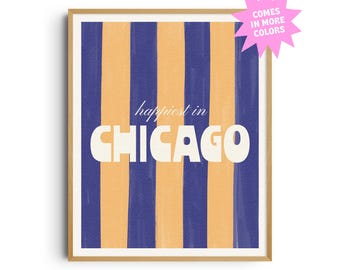 May include: A framed art print with a vertical striped pattern in navy blue and light orange. The text "happiest in CHICAGO" is centered on the print. A pink starburst graphic indicates the print is available in more colors.