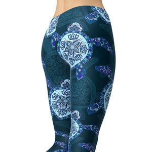 May include: Blue yoga leggings with a pattern of blue and white sea turtles with mandala designs. The leggings are shown on a model from the back.