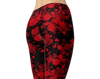 May include: Red and black leggings with a splatter paint design. The leggings are available in shorts, capri, and full length.