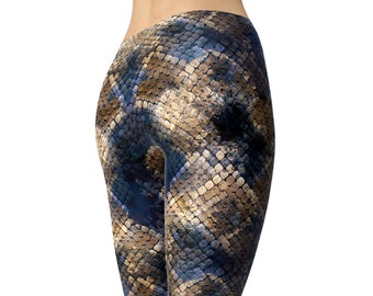 May include: A pair of blue and brown leggings with a snake skin pattern. The leggings are fitted and have a high waist.