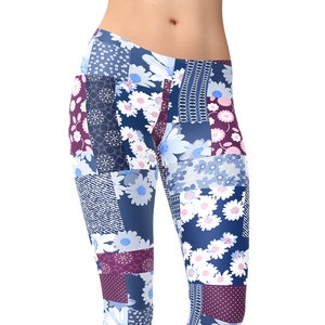 May include: A pair of blue leggings with a patchwork design featuring white flowers and purple accents. The leggings are made of a stretchy, comfortable fabric and are perfect for yoga, running, or everyday wear.