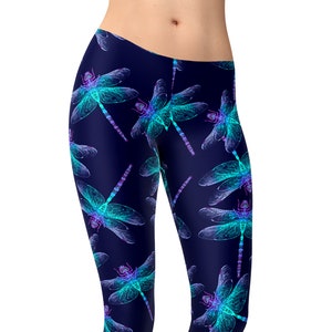 May include: Navy blue leggings with a repeating pattern of neon blue and purple dragonflies.
