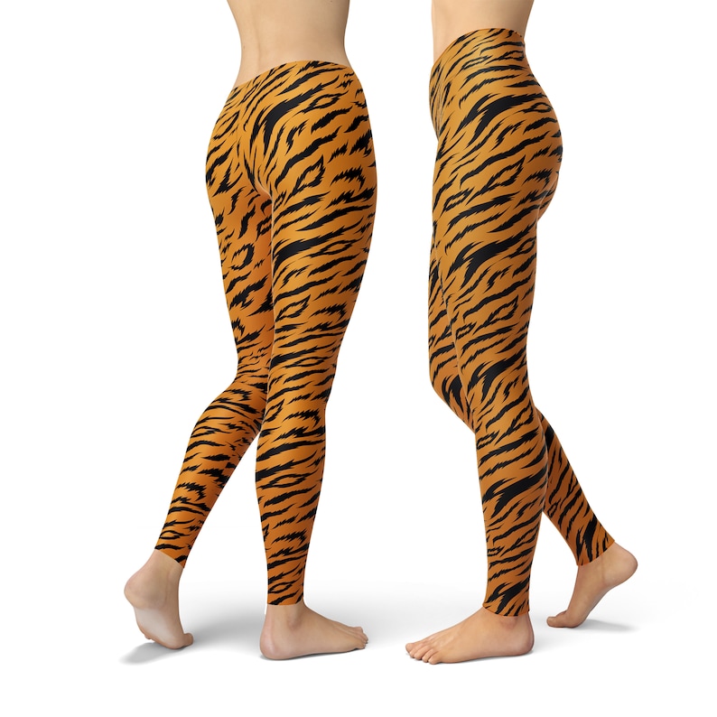 May include: A pair of leggings with a tiger stripe pattern in orange and black.
