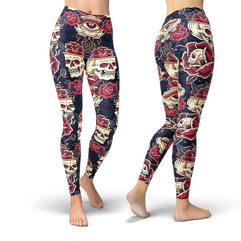 May include: Black leggings with a colorful print of skulls, roses, and an eye. The print is a vintage tattoo style.