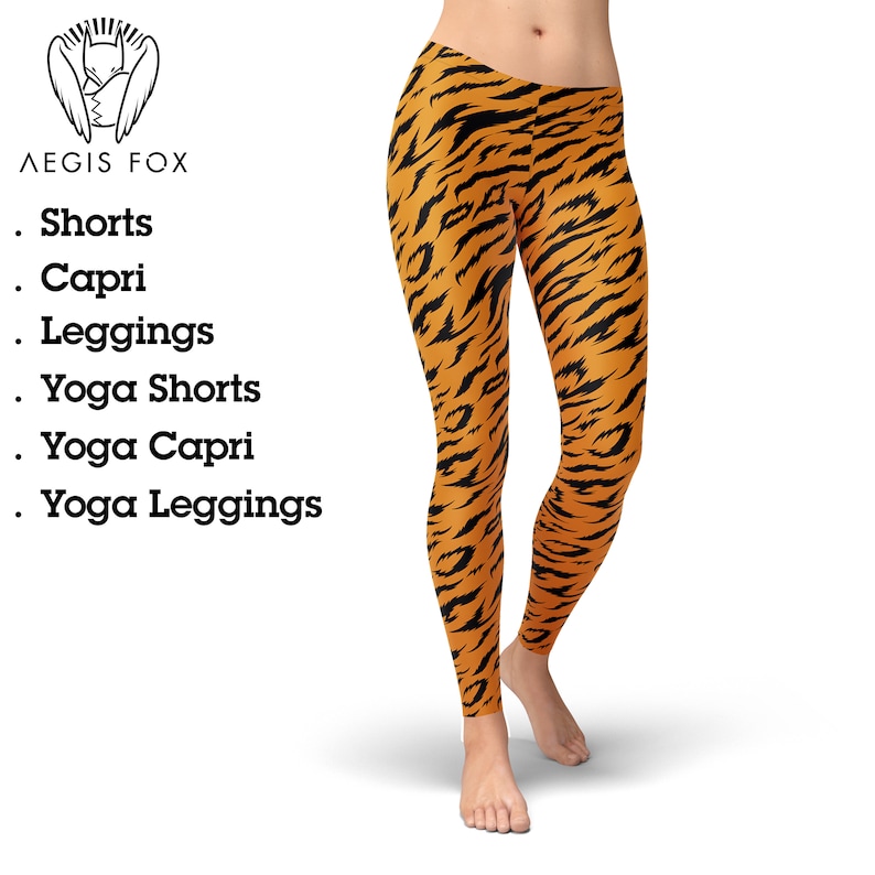May include: Orange and black leggings with a tiger stripe pattern. The leggings are made of a stretchy, comfortable fabric and are perfect for yoga, running, or everyday wear.
