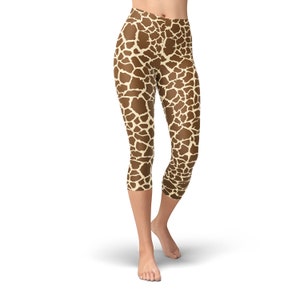 May include: Cropped leggings with a giraffe print pattern in brown and beige.