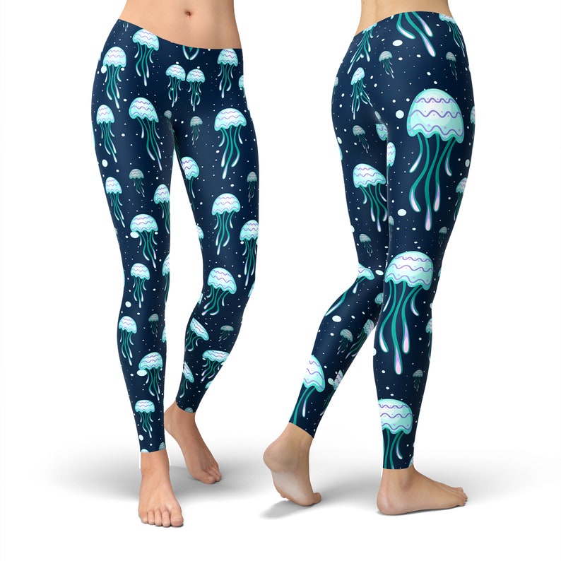 May include: Blue leggings with a repeating pattern of white jellyfish on a dark blue background.