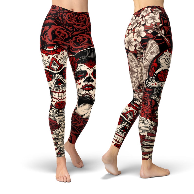 May include: Red and white leggings with a skull and flower design. The leggings feature a sugar skull with flowers and butterflies.