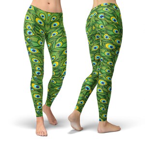 May include: Green leggings with a peacock feather pattern. The pattern features blue and yellow accents.