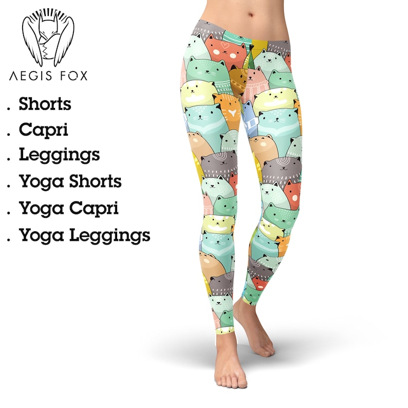 May include: A pair of leggings with a colorful pattern of cartoon cats. The cats are in various shades of green, blue, orange, and pink. The leggings are a great option for yoga, running, or everyday wear.