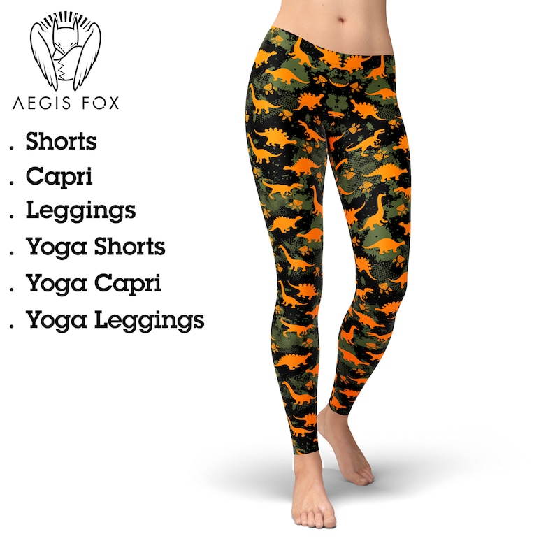 May include: Black leggings with a camouflage pattern featuring orange dinosaurs. The leggings are available in shorts, capri, leggings, yoga shorts, yoga capri, and yoga leggings.