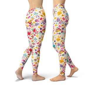 May include: White leggings with a colourful Easter-themed pattern featuring bunnies, chicks, eggs, and flowers.