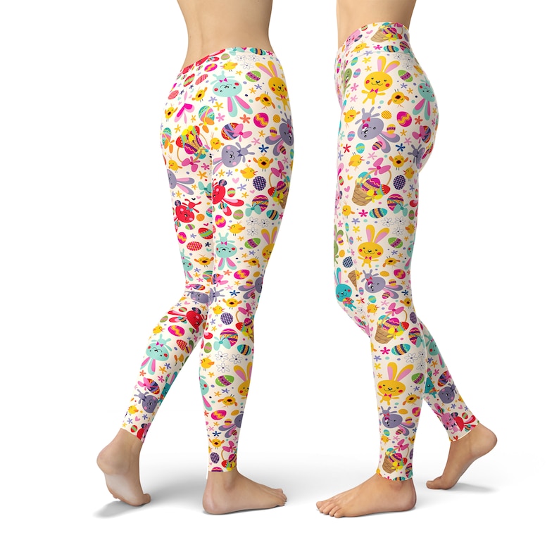May include: White leggings with a colourful Easter-themed pattern featuring bunnies, chicks, eggs, and flowers.