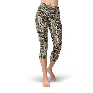 May include: Cropped leggings with a brown and beige snake skin pattern.