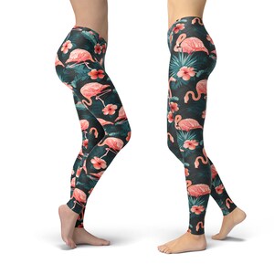 May include: Black leggings with a tropical print featuring pink flamingos and green leaves.