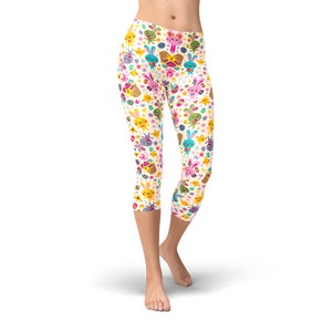 May include: White capri leggings with a colourful Easter-themed pattern featuring bunnies, chicks, and eggs.