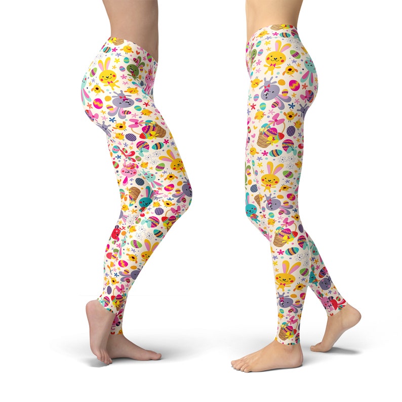 May include: White leggings with a colourful Easter-themed pattern featuring bunnies, eggs, and flowers.