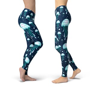 May include: A pair of dark blue leggings with a repeating pattern of light blue jellyfish on a dark blue background.