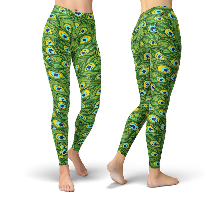 May include: Green leggings with a peacock feather pattern. The leggings have a bright green background with blue and yellow peacock feathers.