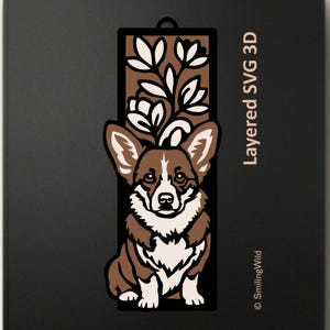 Op de afbeelding: Een gelaagd 3D-ontwerp met een bruin-witte corgi-hond met een bloemstuk bovenop zijn hoofd. Het ontwerp staat tegen een donkere achtergrond, met de tekst "Layered SVG 3D" en "SmilingWild" zichtbaar.