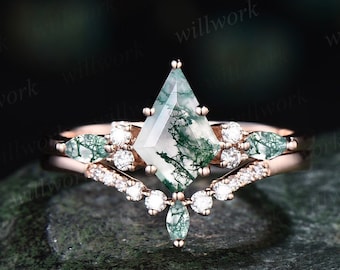 May include: A rose gold engagement ring set with a green moss agate center stone and a diamond accented band.