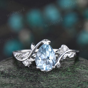 Pear Cut Aquamarine Dress Ring with a Diamond Pave Twisted Shank