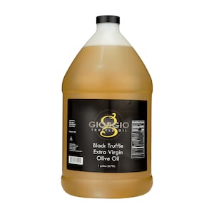 May include: A one-gallon plastic bottle of Giorgio Truffle Oil, a black truffle extra virgin olive oil. The bottle has a black label with white text and a gold logo.