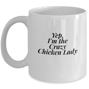 May include: White ceramic coffee mug with black text that reads "Yep. I'm the Crazy Chicken Lady".