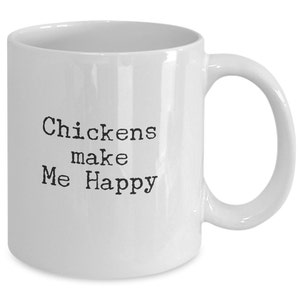 May include: White ceramic coffee mug with black text that reads "Chickens make Me Happy".