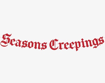 May include: A red banner with the words "Seasons Creepings" in a gothic font, strung on a thin red string. The banner is against a white background.