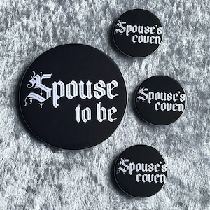May include: Three black round buttons with white text. The largest button says "Spouse to be". The smaller buttons say "Spouse's coven".
