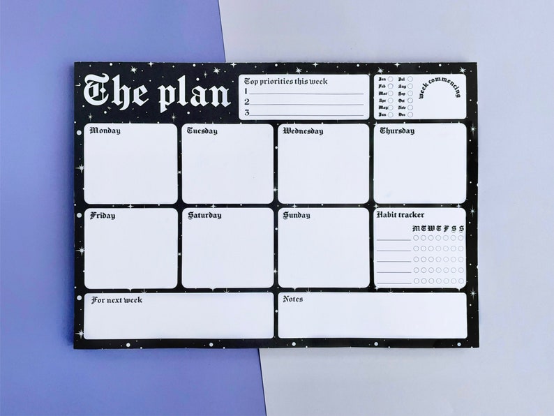 May include: A black and white weekly planner with a starry night design. The planner includes sections for daily tasks, top priorities, habit tracking, and notes. The text "The plan" is written in a gothic font at the top of the planner.