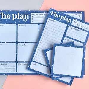 May include: A set of blue and white planner pages with a starry night design. The pages include sections for daily scheduling, weekly planning, habit tracking, and notes. The text "The plan" is printed in a retro font.