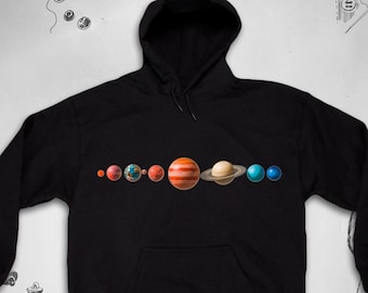 May include: Black hooded sweatshirt with a graphic print of the planets in our solar system. The planets are depicted in their relative sizes and colors.