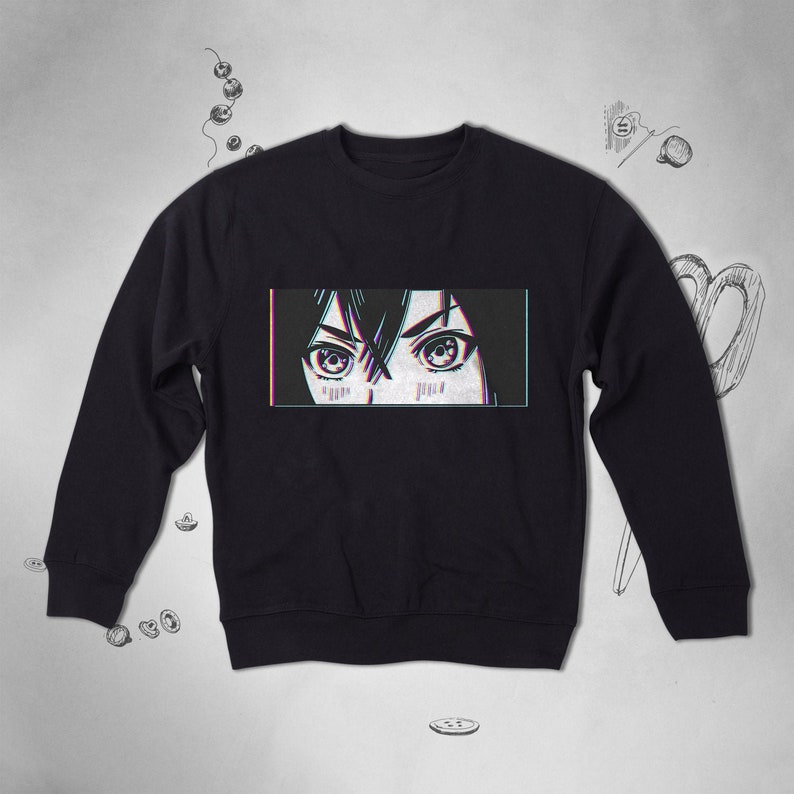 Pode incluir: Camisola de moletom preta com uma estampa gr&aacute;fica de olhos de mulher com efeito glitch. Os olhos s&atilde;o grandes e t&ecirc;m um contorno escuro. O fundo &eacute; preto.