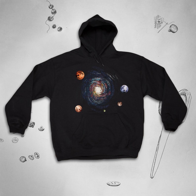 May include: Black hooded sweatshirt with a galaxy print and planets in orange, red, and blue.
