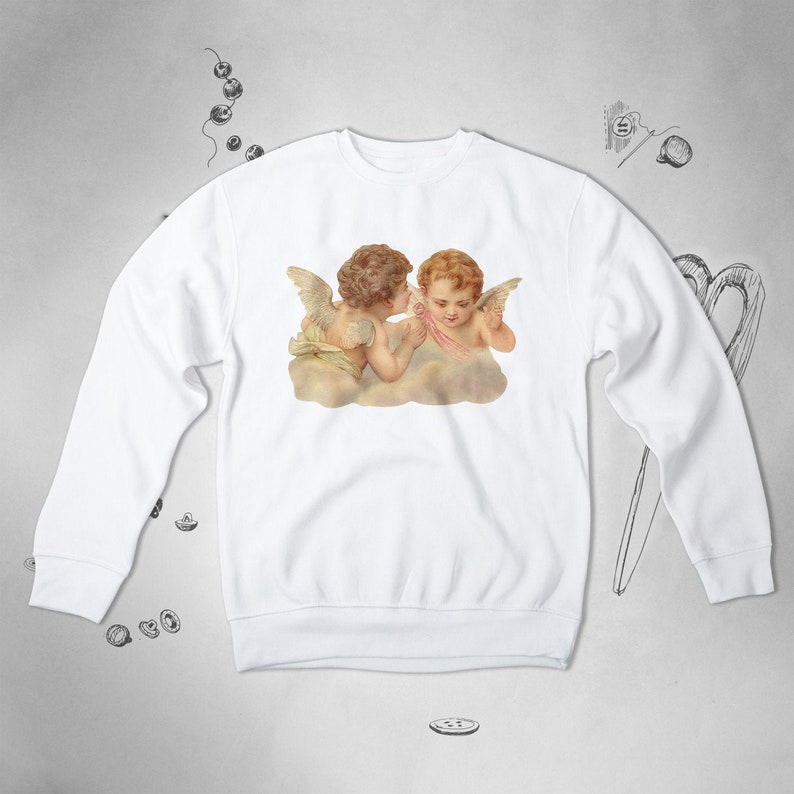 May include: White sweatshirt with a graphic print of two cherubs with wings, one whispering to the other.